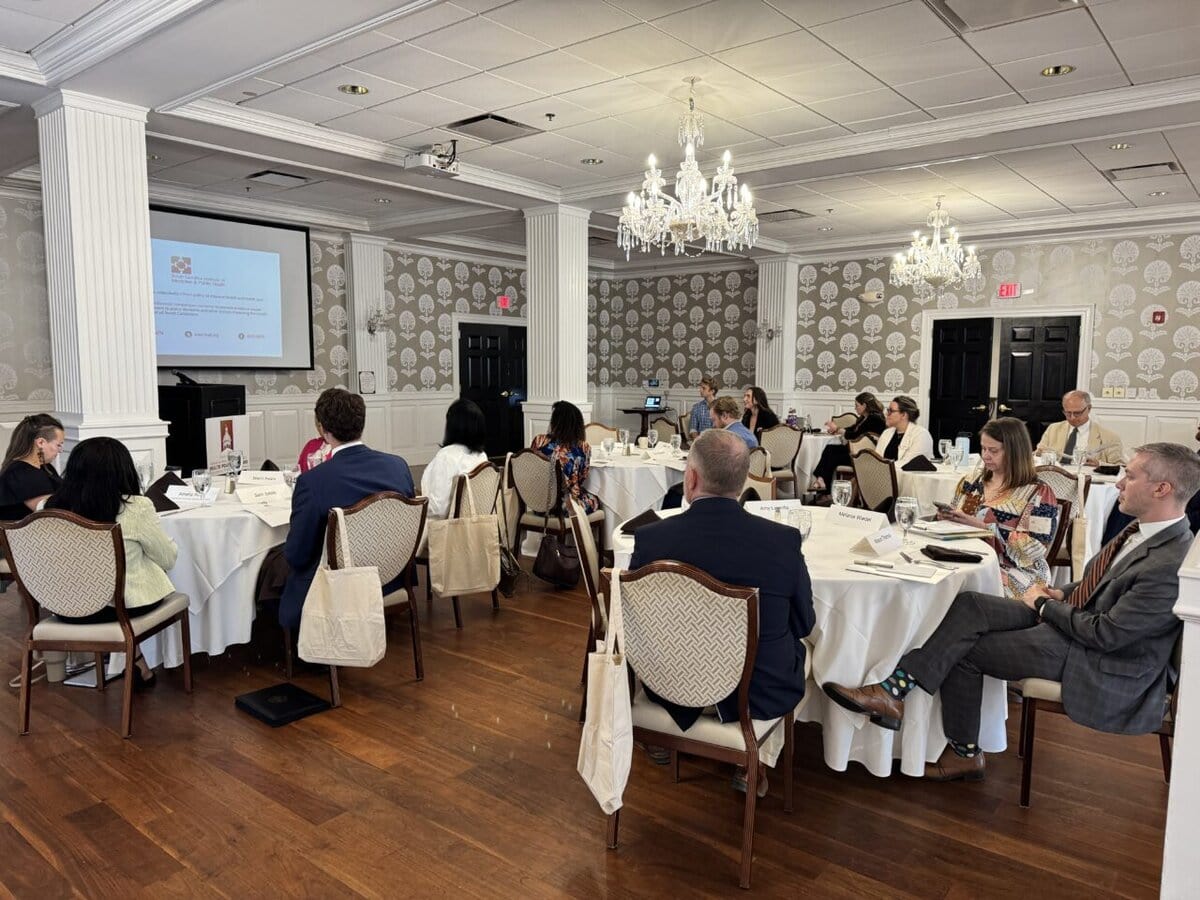 Several tables with legislative staffers sitting at the 2024 Lunch and Learn.